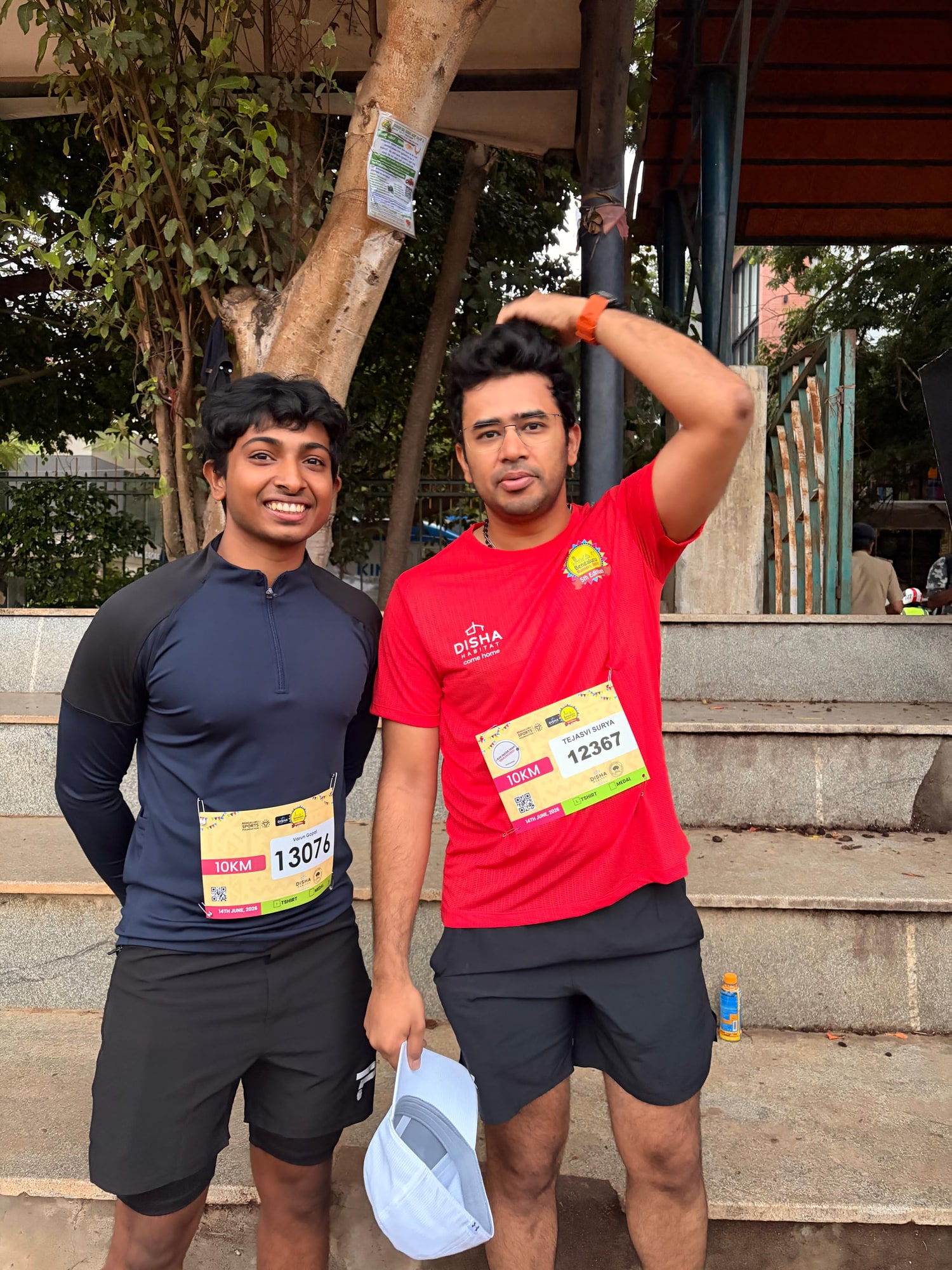 Two runners in Bengaluru Runners Jatre bibs standing together before the start at Shalini Grounds