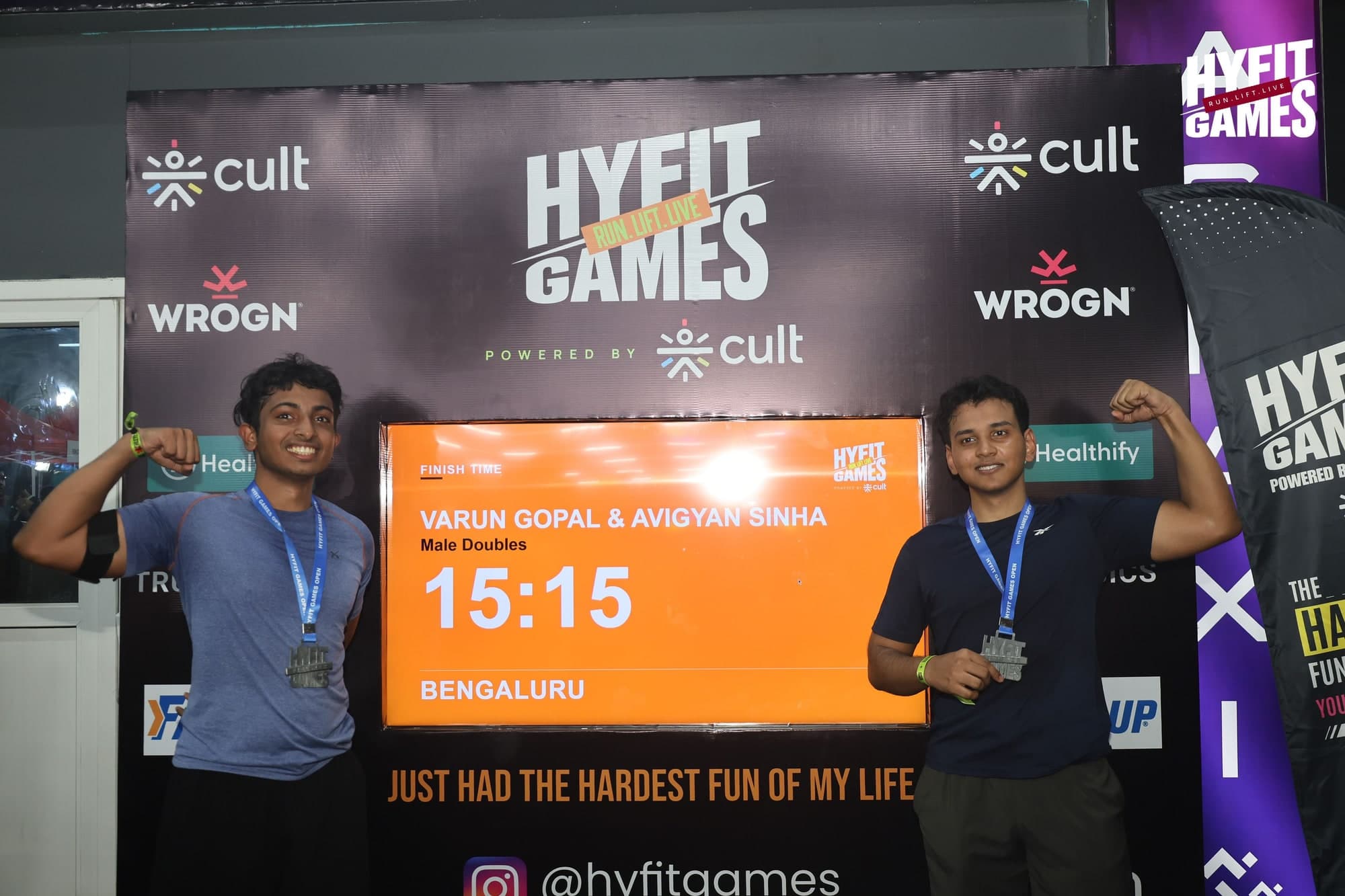 The HYFIT Games Bengaluru finish board showing a male doubles time of 15:15